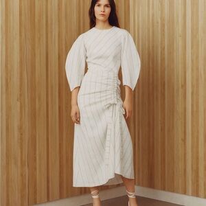 Maje ranchi dress with gathered skirt. White with mustard yellow stripes.